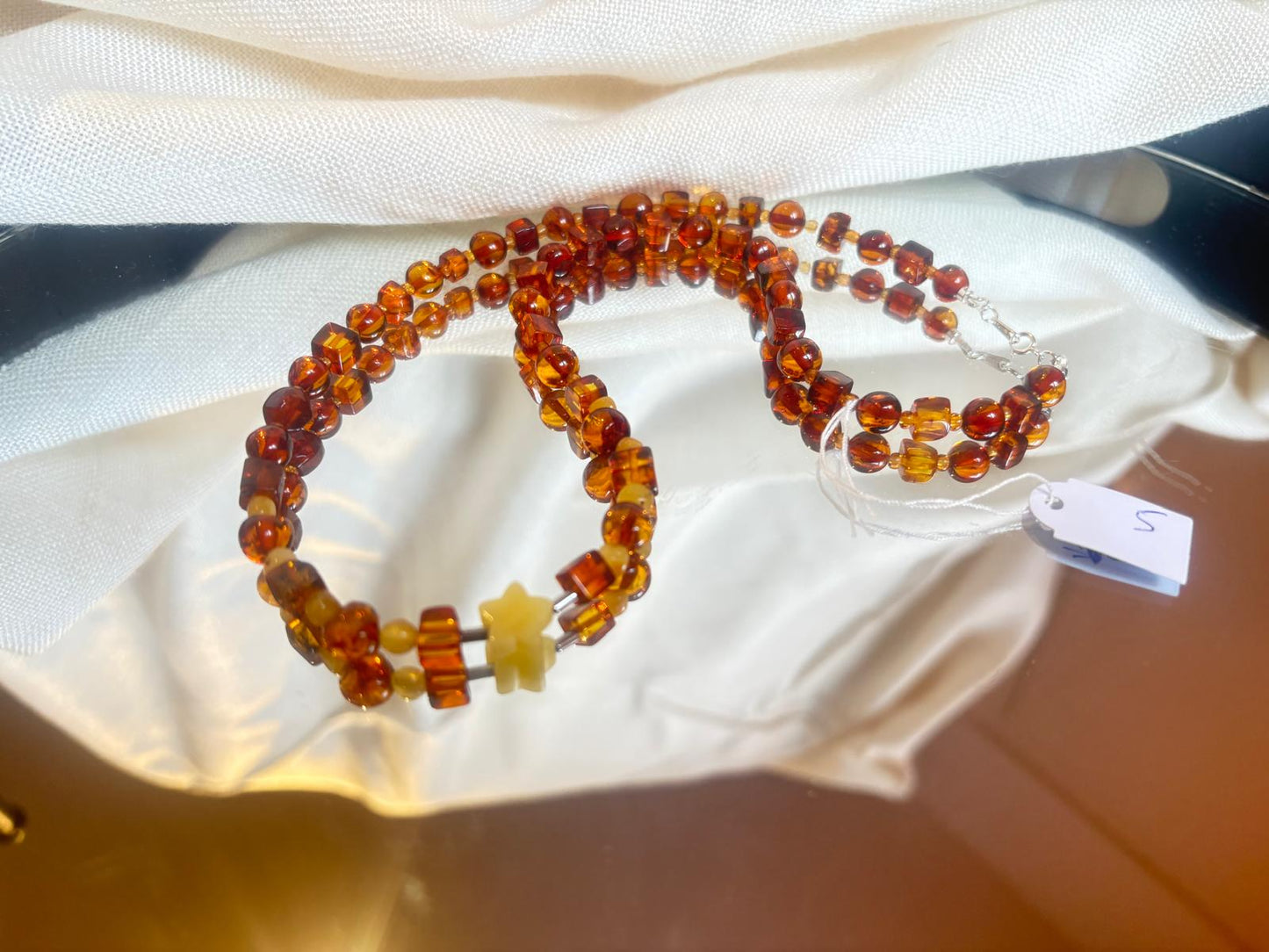 Schöne Halskette in Cognac transparent mit Stern